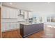 Modern kitchen with white cabinets, granite counters, and stainless steel appliances at 0000 Crown Ter, Hickory, NC 28601