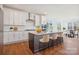 Modern kitchen featuring white cabinets, granite countertops, and an island at 0000 Crown Ter, Hickory, NC 28601