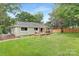 Large backyard featuring a deck with pergola and a fenced yard at 10912 Treebark Dr, Charlotte, NC 28226