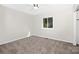 Neutral bedroom features carpet, a window, and a ceiling fan at 10912 Treebark Dr, Charlotte, NC 28226