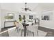 Open-concept dining area with a modern table, backyard access, and seamless flow into the kitchen, great for entertaining at 10912 Treebark Dr, Charlotte, NC 28226