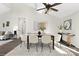 Modern dining room features a dark wood table and cream-colored chairs, plus unique decor and vaulted ceilings at 10912 Treebark Dr, Charlotte, NC 28226
