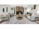 Cozy living room featuring a stone fireplace, neutral color palette, and comfortable seating, perfect for relaxation at 10912 Treebark Dr, Charlotte, NC 28226