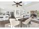Open concept layout with a clear view of the modern kitchen, fireplace and dining area, creating an inviting space at 10912 Treebark Dr, Charlotte, NC 28226