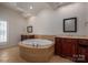 Bathroom with a large corner soaking tub and double vanity at 115 Cloverhill Rd, Mooresville, NC 28117