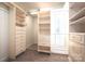 Walk-in closet with ample shelving and drawer space at 115 Cloverhill Rd, Mooresville, NC 28117