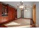 Bright dining room with hardwood floors and elegant light fixtures at 115 Cloverhill Rd, Mooresville, NC 28117