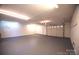 Spacious garage with overhead door and ample storage at 115 Cloverhill Rd, Mooresville, NC 28117