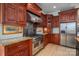 Modern kitchen with stainless steel range and custom cabinetry at 115 Cloverhill Rd, Mooresville, NC 28117