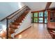 Stunning wooden staircase with wrought iron railing at 115 Cloverhill Rd, Mooresville, NC 28117