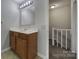 Clean bathroom with wood vanity and tile floor at 1208 Piedmont St, Charlotte, NC 28204