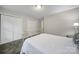 Simple bedroom with brass bed frame and double door closet at 1208 Piedmont St, Charlotte, NC 28204