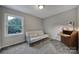 Versatile bedroom with futon and wooden desk at 1208 Piedmont St, Charlotte, NC 28204