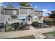 Gray siding home with private patio and small fenced yard at 1208 Piedmont St, Charlotte, NC 28204