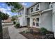 Gray townhome exterior with double front doors and walkway at 1208 Piedmont St, Charlotte, NC 28204