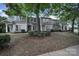 Front view of a row of gray townhomes with landscaping at 1208 Piedmont St, Charlotte, NC 28204