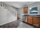 Bright kitchen with wood cabinets, stainless steel appliances, and tile floor at 1208 Piedmont St, Charlotte, NC 28204