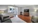 Living room with gray sofa, wood floors, and access to patio at 1208 Piedmont St, Charlotte, NC 28204