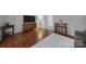 Living room with wood floors, gray sofa and a TV stand at 1208 Piedmont St, Charlotte, NC 28204