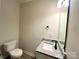 Powder room featuring granite countertop vanity and modern fixtures at 129 Sharon Rd, York, SC 29745