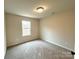 Bright bedroom with neutral walls and carpet at 129 Sharon Rd, York, SC 29745