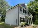 Charming two-story home featuring gray siding, black shutters, and a welcoming covered front porch at 129 Sharon Rd, York, SC 29745