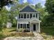 Charming two-story home featuring a covered front porch and a well-maintained lawn at 129 Sharon Rd, York, SC 29745