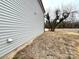 Side view of house with gray siding and landscaping at 129 Sharon Rd, York, SC 29745