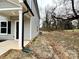 Side view of house showing gray siding and landscaping at 129 Sharon Rd, York, SC 29745