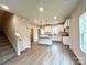 Open-concept kitchen with a large island, white cabinets, and modern appliances at 129 Sharon Rd, York, SC 29745