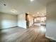 Open-concept living area with modern flooring flowing into the kitchen at 129 Sharon Rd, York, SC 29745