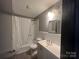 Clean bathroom with white vanity and tub at 1401 Lasalle St, Charlotte, NC 28216