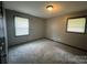 Simple bedroom with gray walls and carpet at 1401 Lasalle St, Charlotte, NC 28216