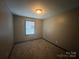 Bright bedroom with gray walls and carpet at 1401 Lasalle St, Charlotte, NC 28216