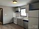 Gray kitchen with white appliances at 1401 Lasalle St, Charlotte, NC 28216