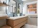 Elegant bathroom with double vanity, geometric tile, and modern fixtures at 1408 Edgewater Dr, Charlotte, NC 28210