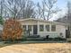 White brick ranch house with landscaping at 1408 Edgewater Dr, Charlotte, NC 28210