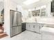 Modern kitchen with stainless steel appliances and white cabinets at 1408 Edgewater Dr, Charlotte, NC 28210