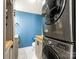 Convenient laundry room with stacked washer and dryer at 1408 Edgewater Dr, Charlotte, NC 28210