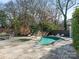 Large freeform pool and spa with ample patio space at 1408 Edgewater Dr, Charlotte, NC 28210