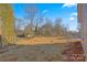 Large backyard with cleared land and some trees at 1443 Southwest Blvd, Newton, NC 28658