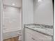 Clean bathroom with white tub and granite countertop at 1443 Southwest Blvd, Newton, NC 28658