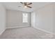 Spacious bedroom with neutral carpeting and ceiling fan at 1443 Southwest Blvd, Newton, NC 28658