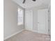 Well-lit bedroom featuring carpet and double door closet at 1443 Southwest Blvd, Newton, NC 28658