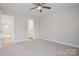 Bedroom with carpet flooring, neutral walls and access to a bathroom at 1443 Southwest Blvd, Newton, NC 28658