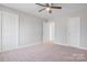 Main bedroom with carpet flooring and multiple doors at 1443 Southwest Blvd, Newton, NC 28658