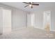 Main bedroom with carpet flooring and multiple doors at 1443 Southwest Blvd, Newton, NC 28658