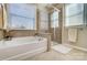 Bathroom with soaking tub and glass shower at 14818 Long Iron Dr, Huntersville, NC 28078