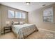 Comfortable bedroom with a queen-size bed and soft color palette at 14818 Long Iron Dr, Huntersville, NC 28078