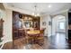 Charming breakfast nook with built-in cabinetry and round wooden table at 14818 Long Iron Dr, Huntersville, NC 28078